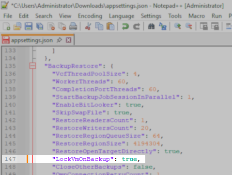 Notepad++ window displaying part of an appsettings.json file. The line '"LockVmOnBackup": true,' is highlighted within the "BackupRestore" settings section.